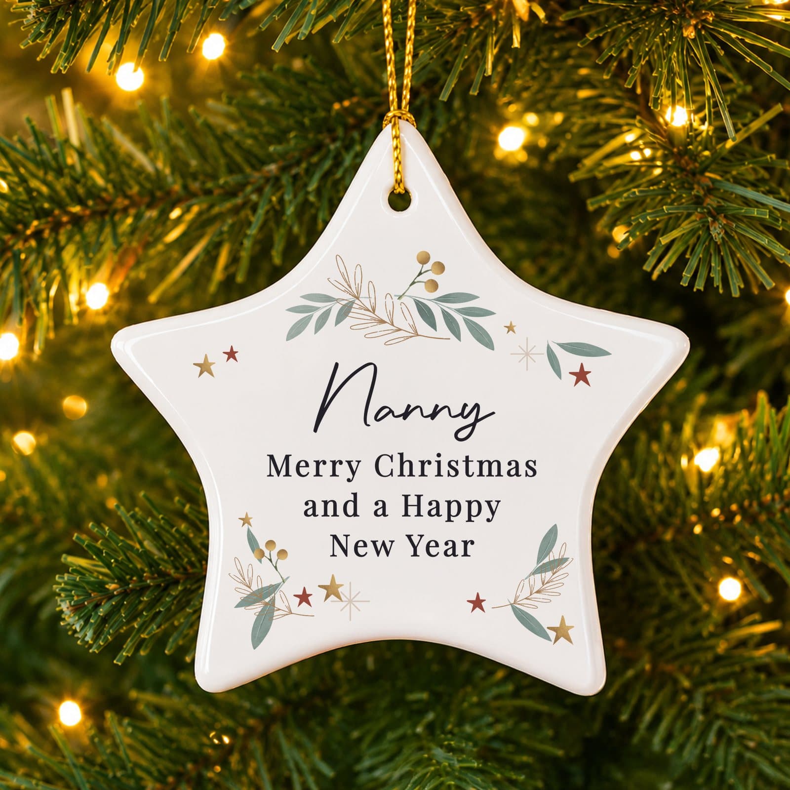 Personalised botanical ceramic star Christmas decoration with a ribbon
