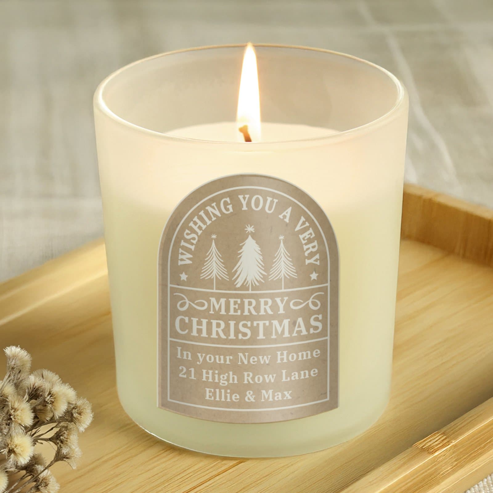 Amber glass Christmas candle jar with personalised lines and a festive greeting