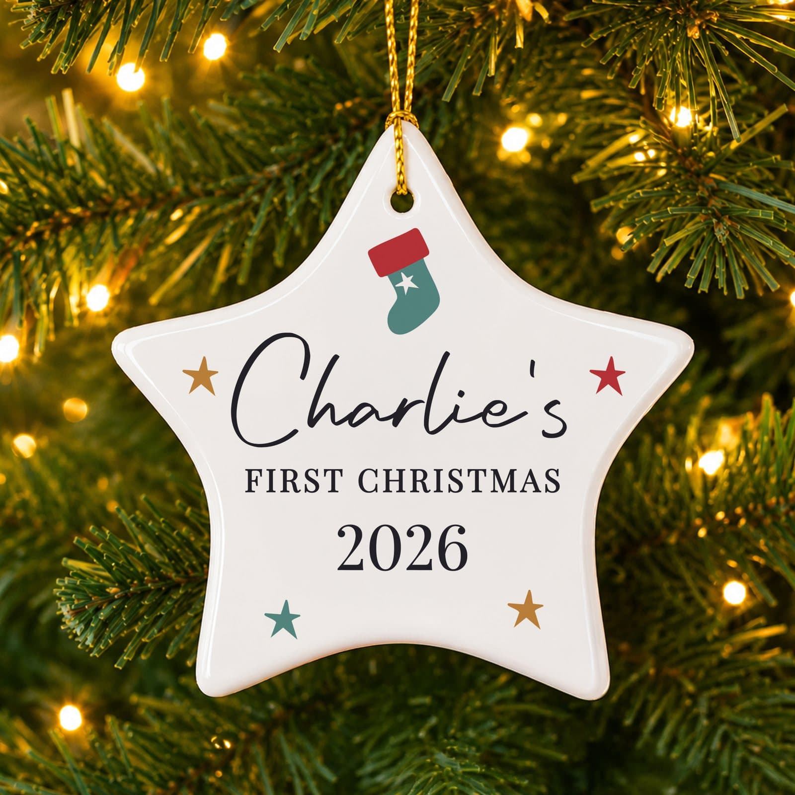 Ceramic star Christmas decoration with three lines of personalised text and a ribbon