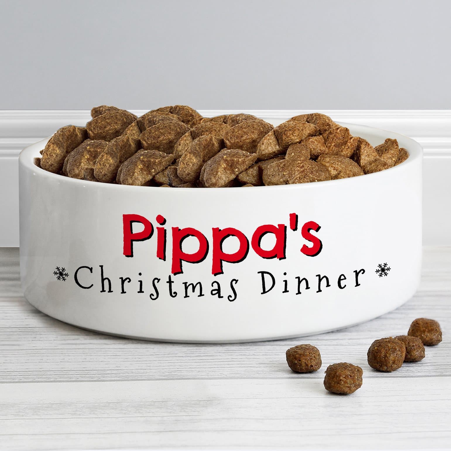 White ceramic pet bowl with Christmas Dinner text and a personalised pet name