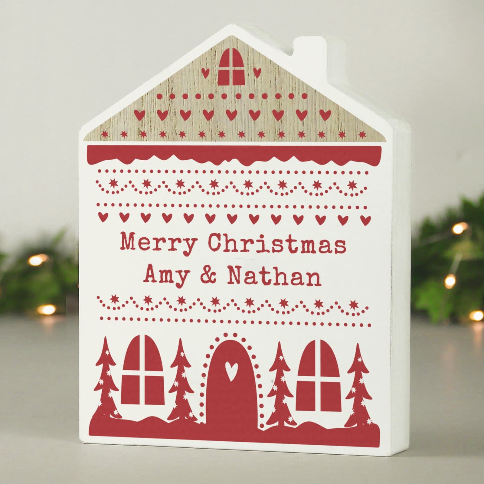 Free-standing wooden house ornament in neutral grey with a Fair Isle design