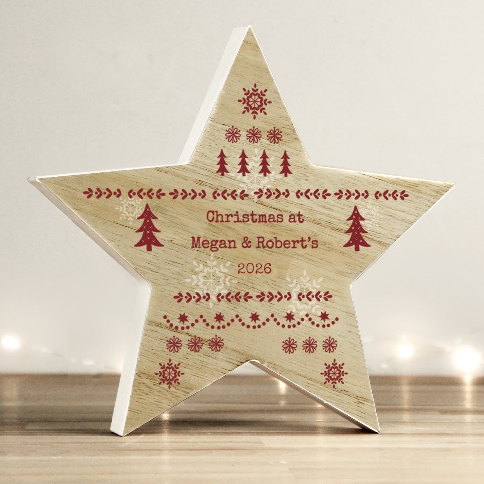 Wooden star ornament with a Fair Isle design and three lines of personalised text