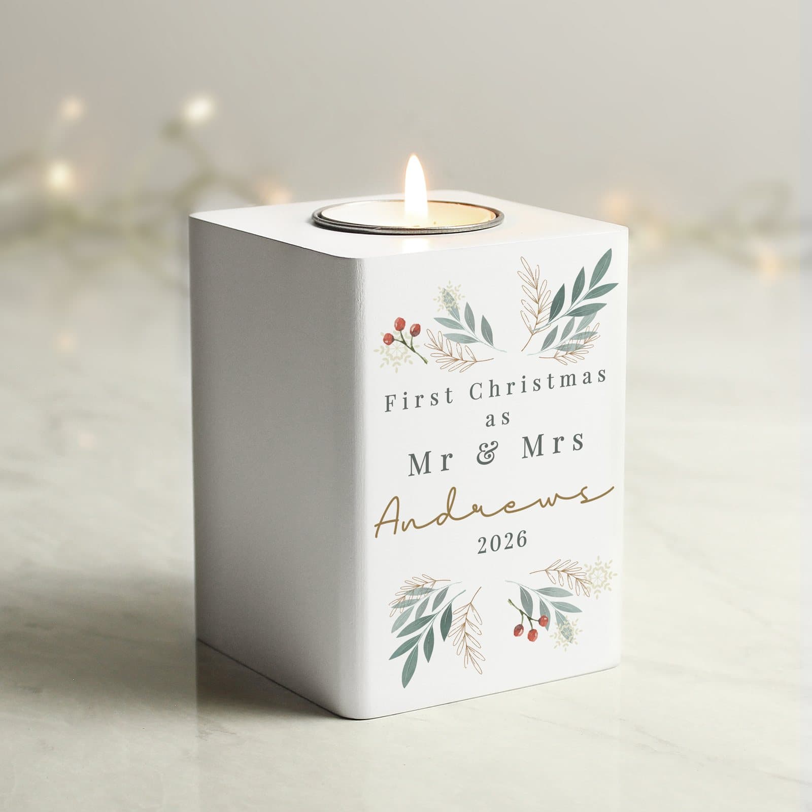 White painted wood tealight holder with Christmas foliage patterns and personalised text