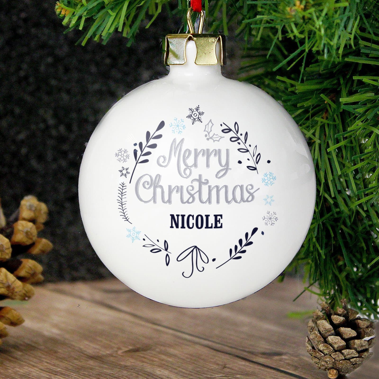 Frost Christmas bauble with personalised text on the front and a hanging ribbon