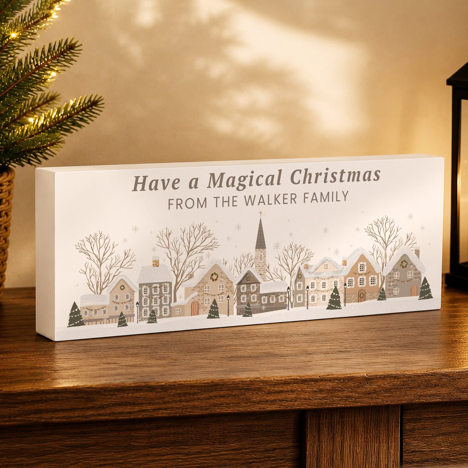 Wooden Christmas mantle block with a wintry house scene and two lines of text