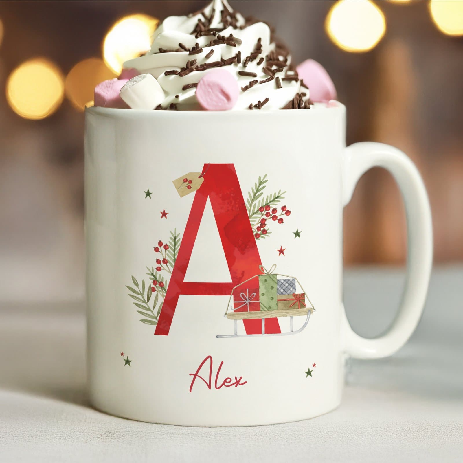 Personalised ceramic Christmas mug with an initial and a name