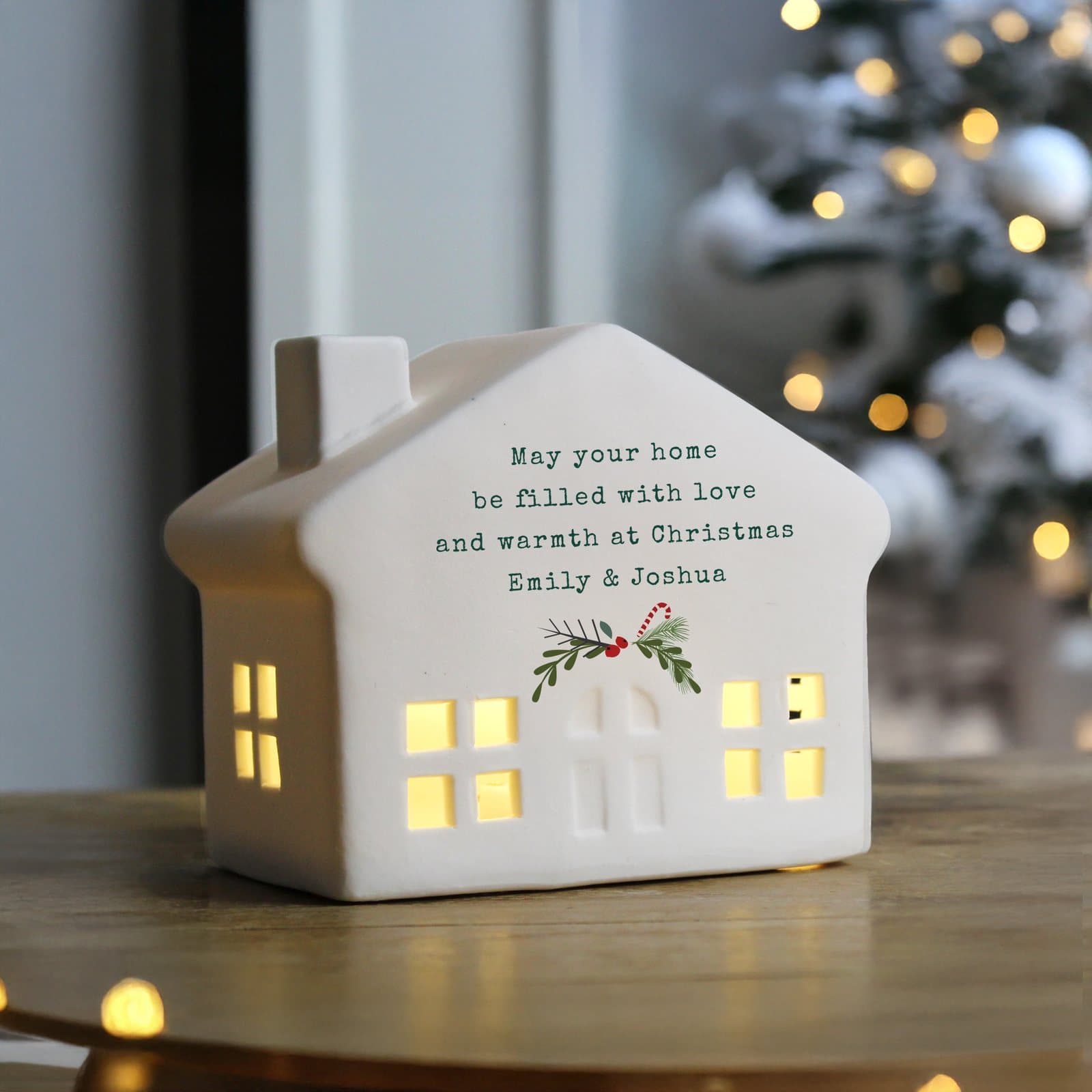 Ceramic light-up Christmas house with cut-out windows and a personalised message