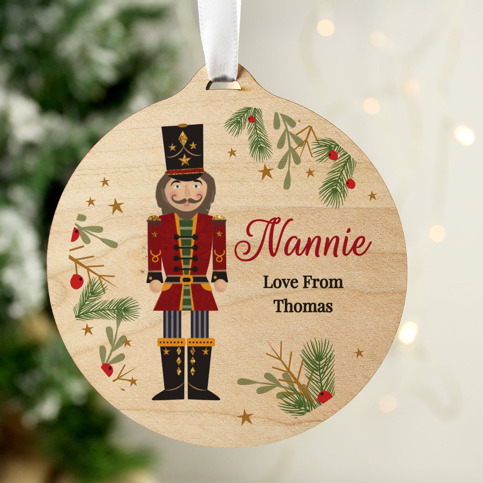 Personalised round wooden nutcracker Christmas bauble with ribbon