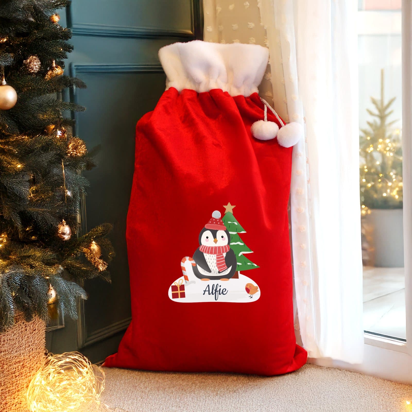 Red penguin Christmas fleece sack with a pom pom, personalised with a name