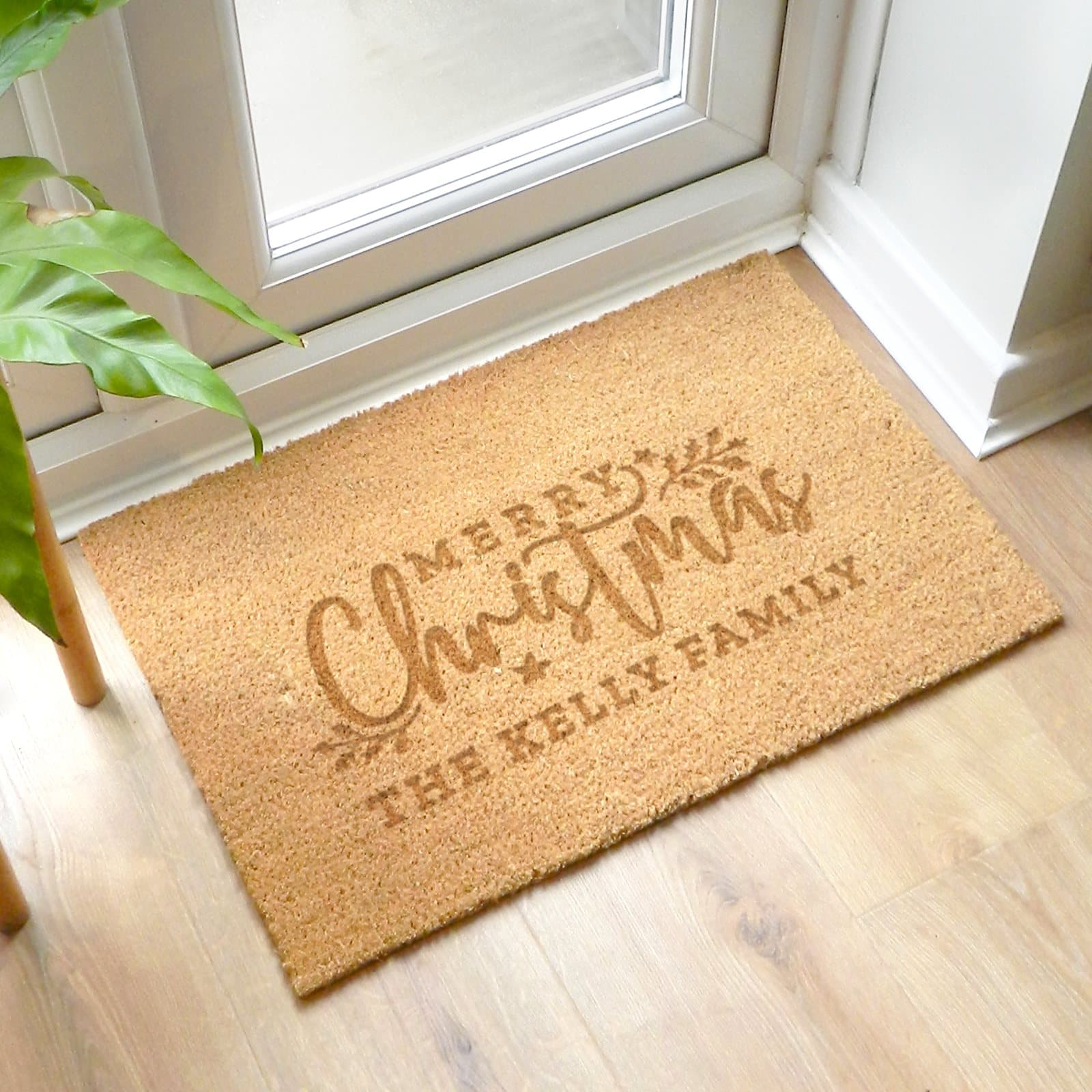 Rectangle coir Christmas doormat reading Merry Christmas with a personalised line