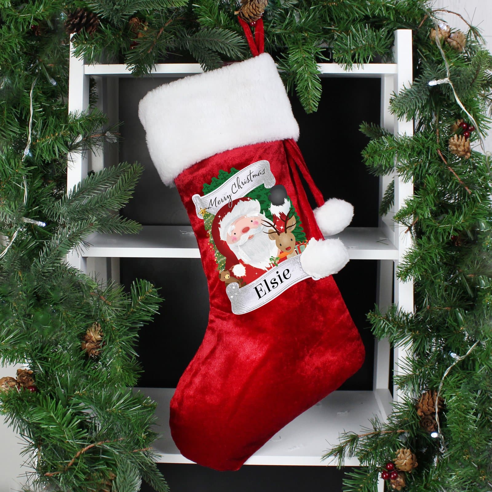 Red velvet Christmas stocking with a plush white cuff and a hoop on top