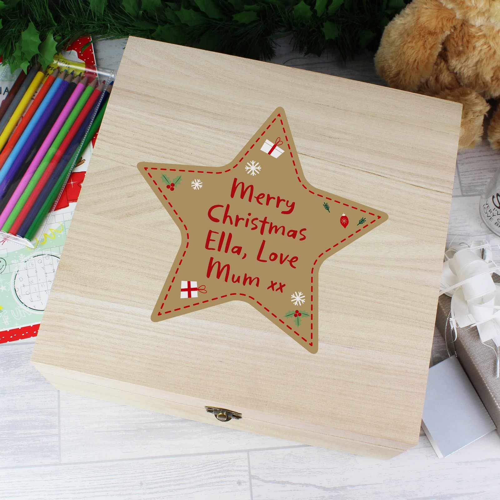 Brightly decorated wooden Christmas star keepsake box with a metal clasp