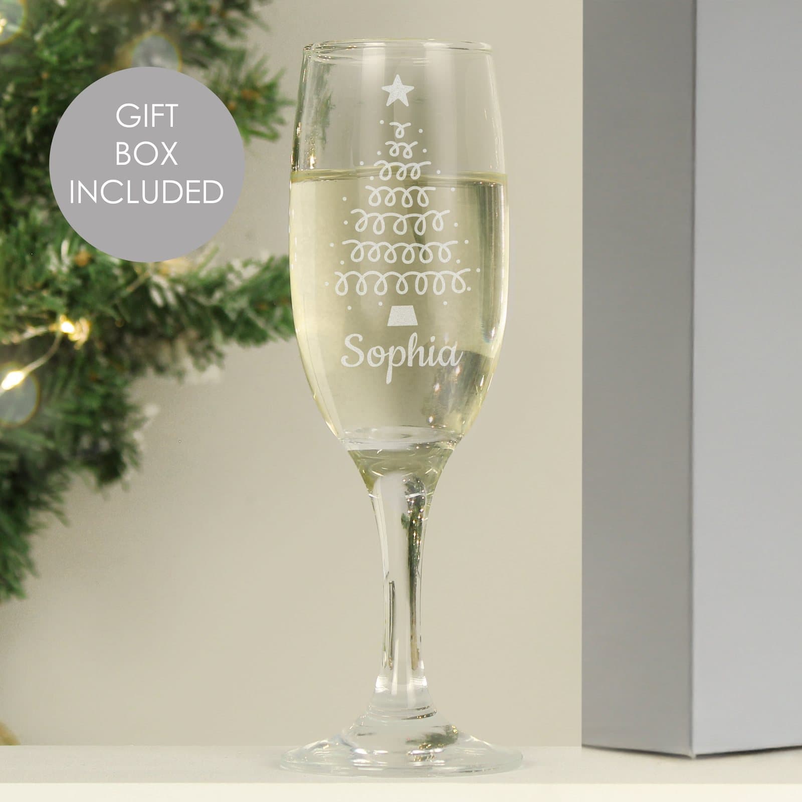 Glass flute with an etched Christmas tree design and a personalised name