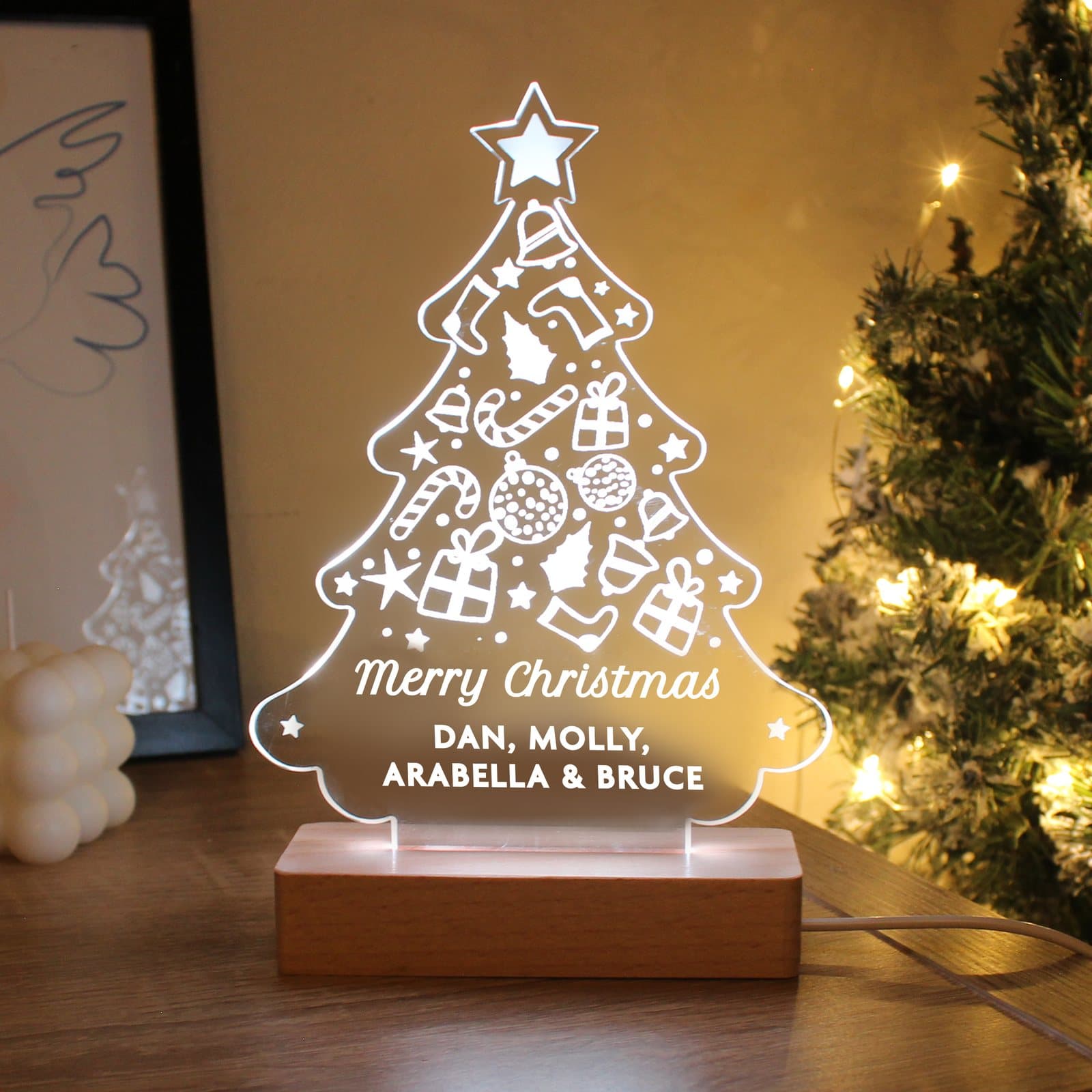 Christmas tree LED light sign on a wooden base with personalised text