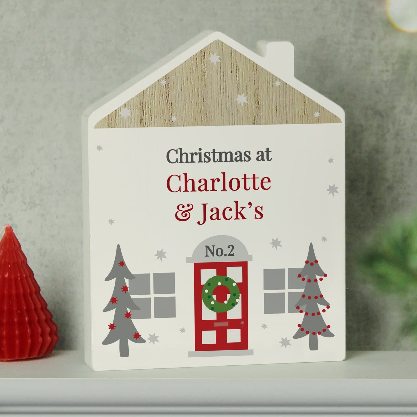 Grey wooden house ornament with personalised message and house number
