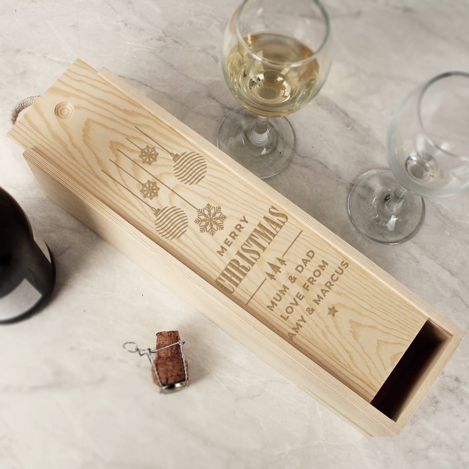 Wooden Christmas wine box with a sliding front and string handle