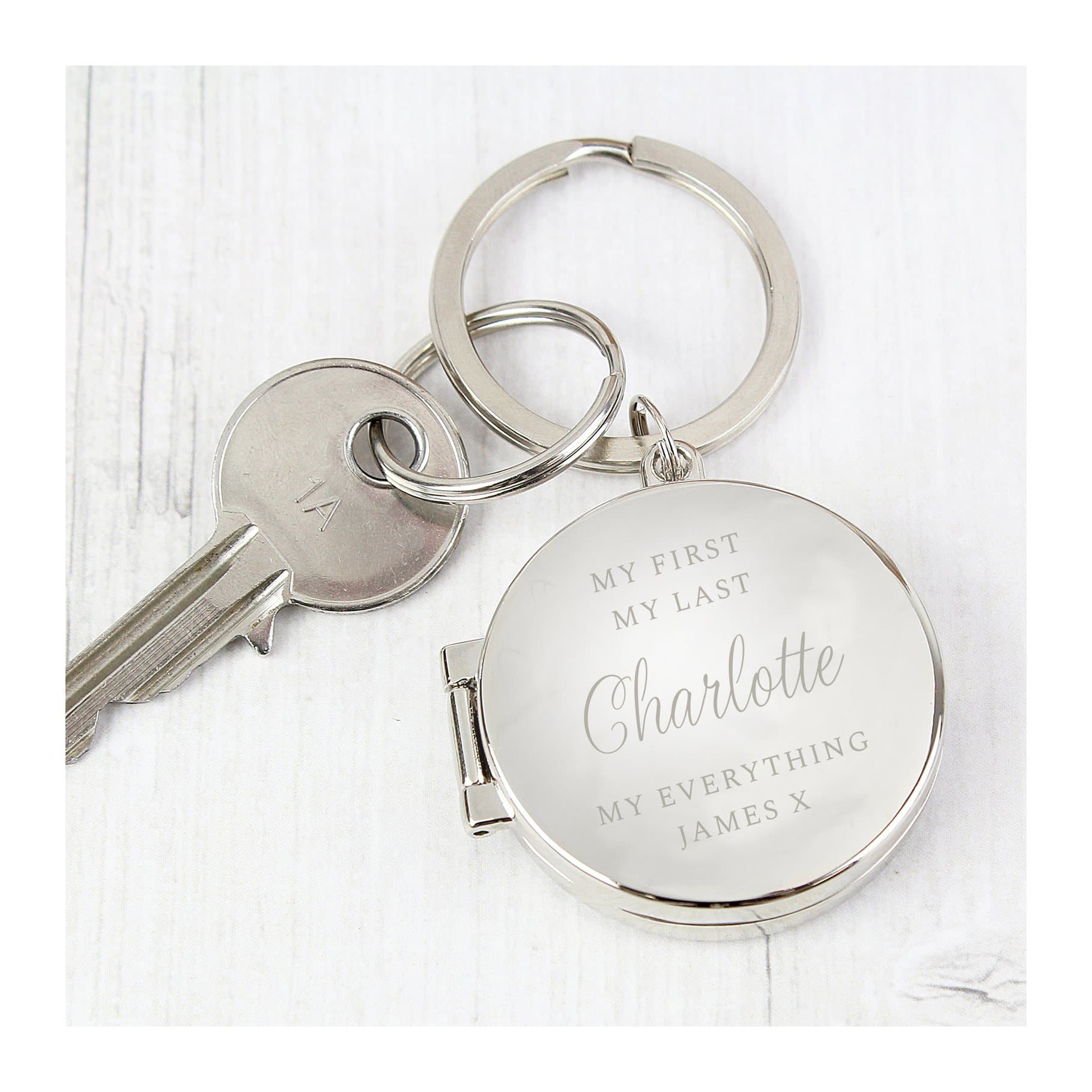 Silver finish photo keyring holding two images with lines of text