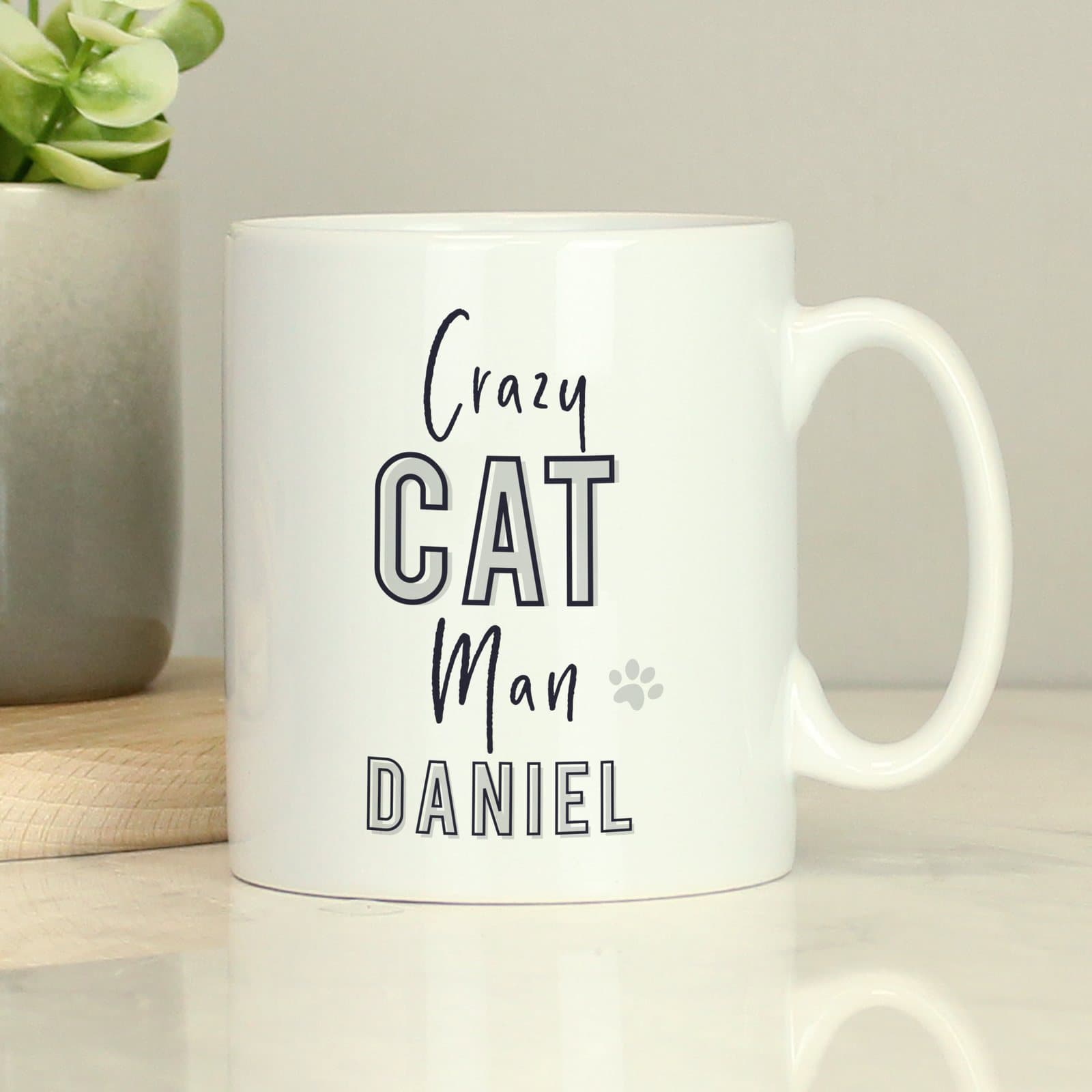 Ceramic mug with the words Crazy Cat Man and a name on the front