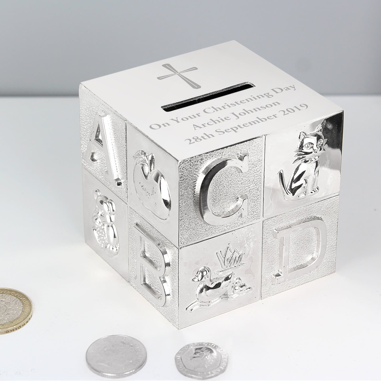 Cross ABC money box engraved with personalised lines below the money slot