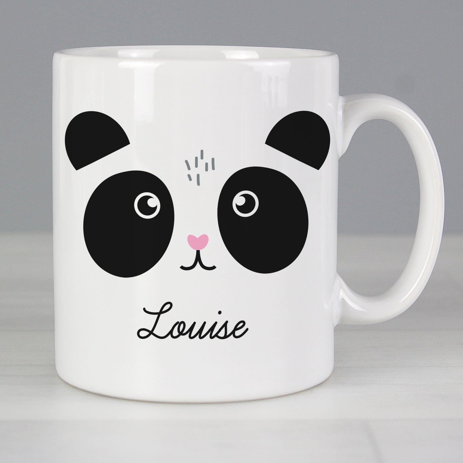 Ceramic mug with a cute panda face design, a name and a message