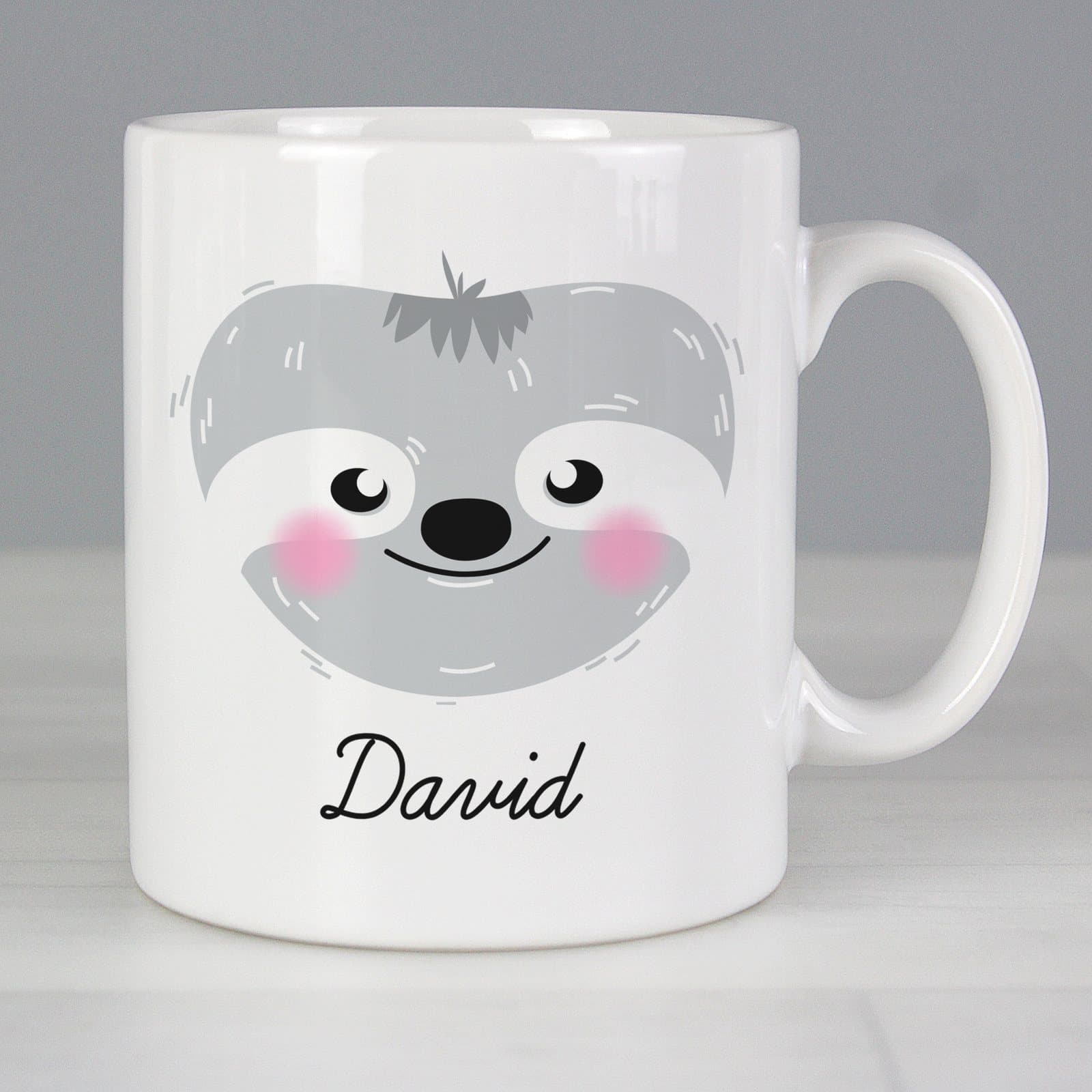 Ceramic mug with a cute sloth face design, a name and a message
