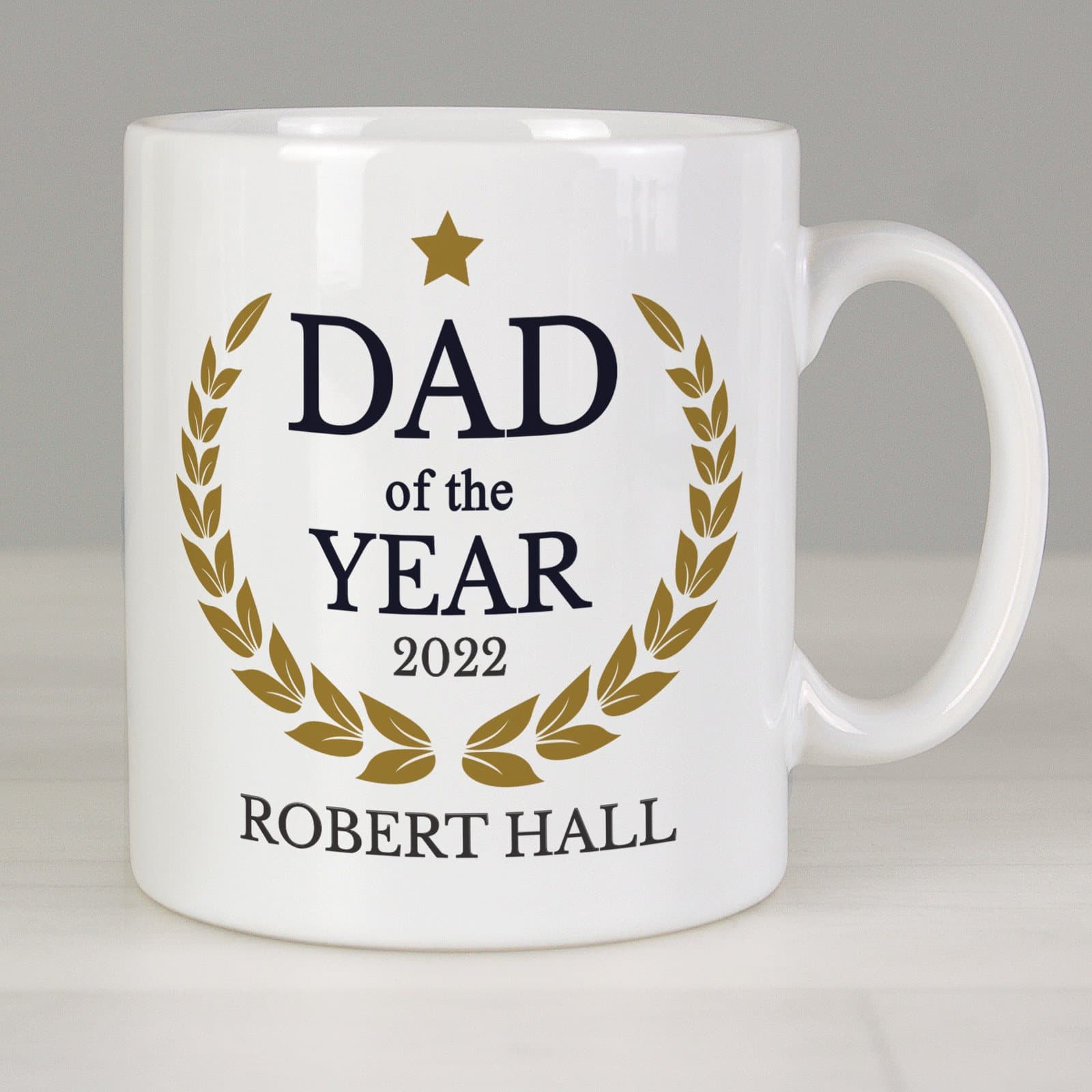 Ceramic Dad of the Year mug with a year and name on the front