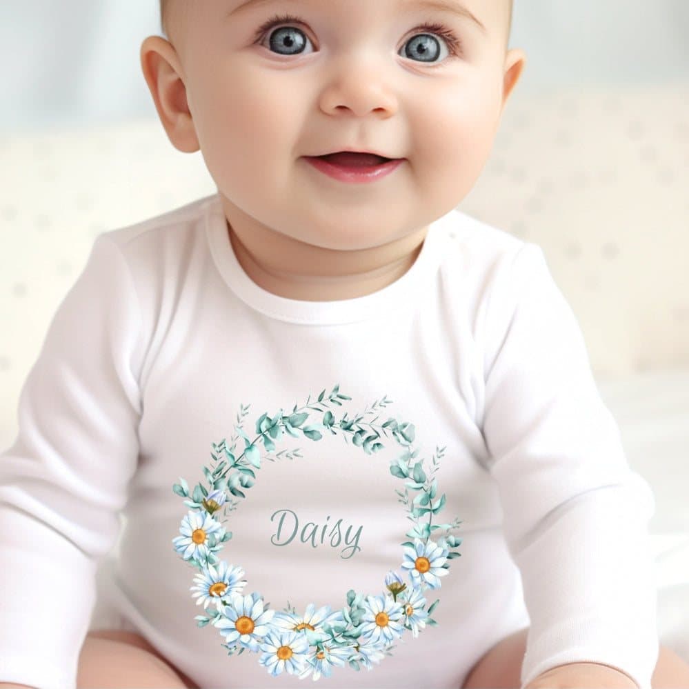Personalised baby grow with a daisy floral circle design and a name