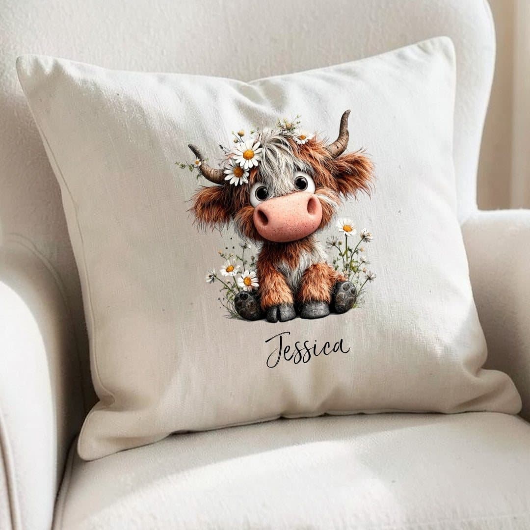 Personalised daisy highland cow cushion with a whimsical cartoon design of daisies