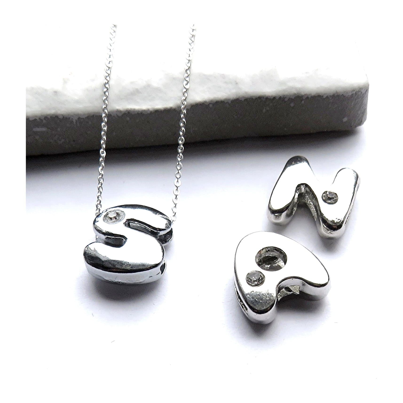 Silver initial necklace with a small diamante letter charm on a chain