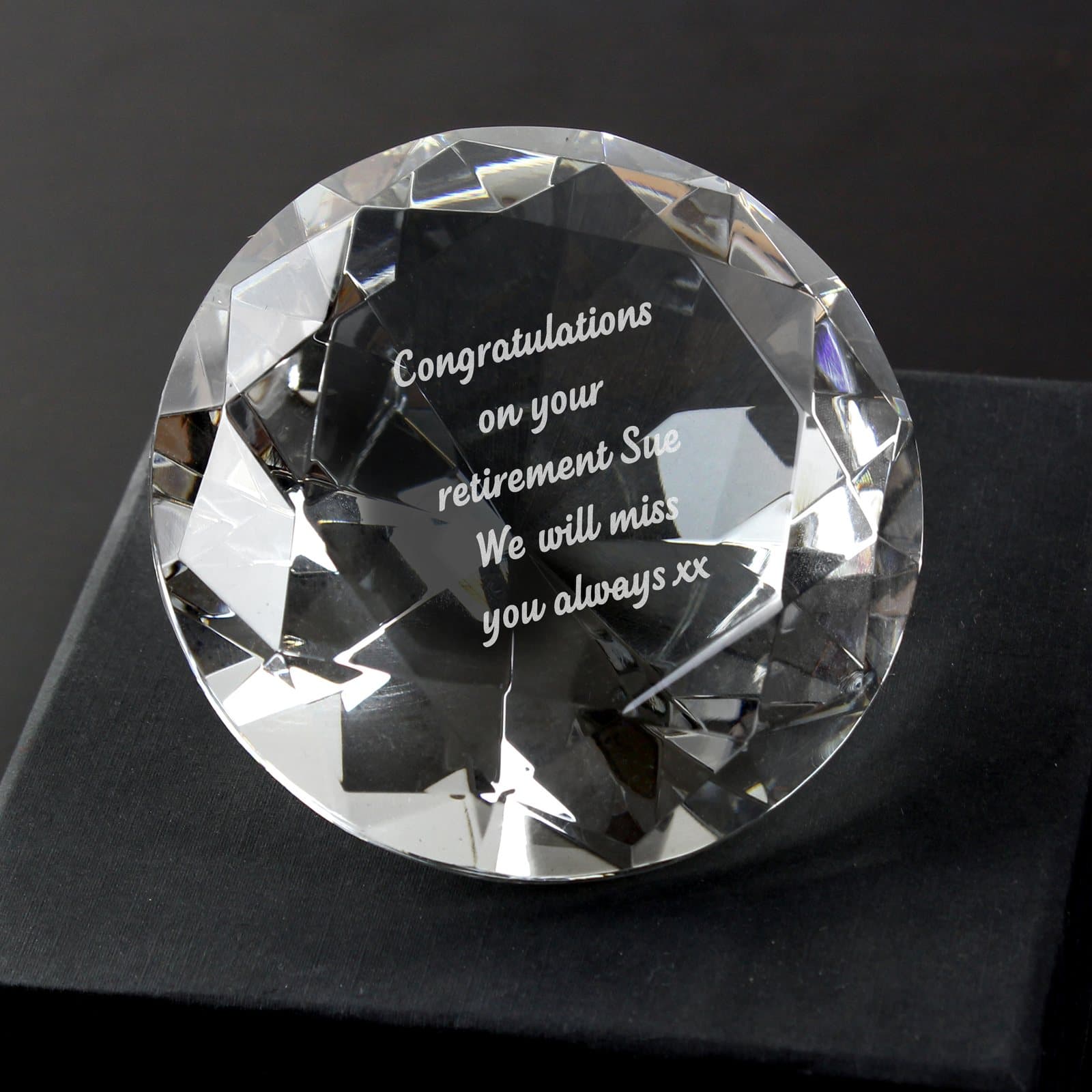 Diamond paperweight with a black silk style lined box