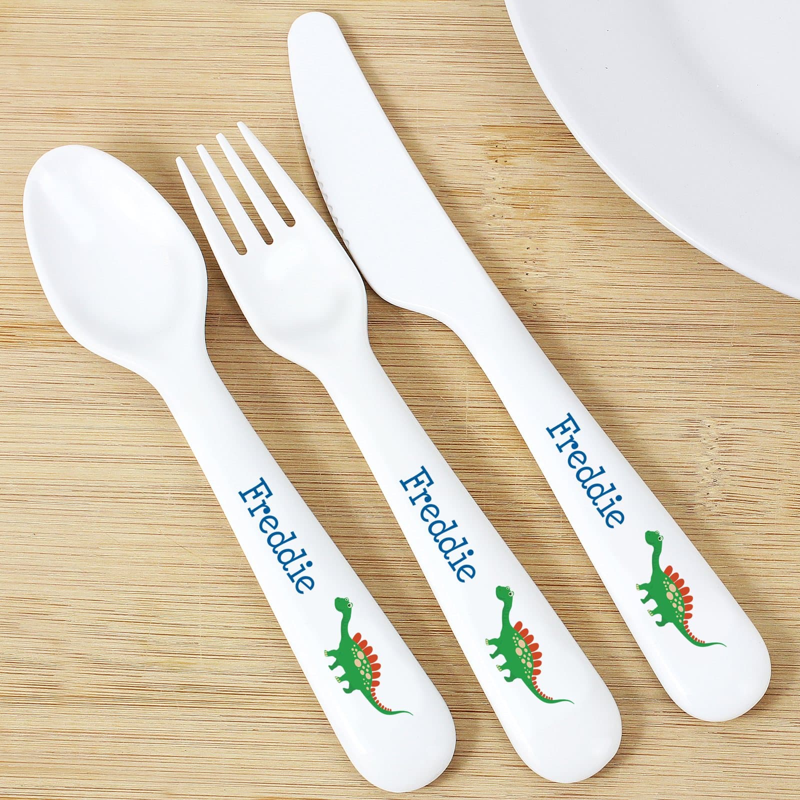 Three piece dinosaur plastic cutlery set with a personalised name
