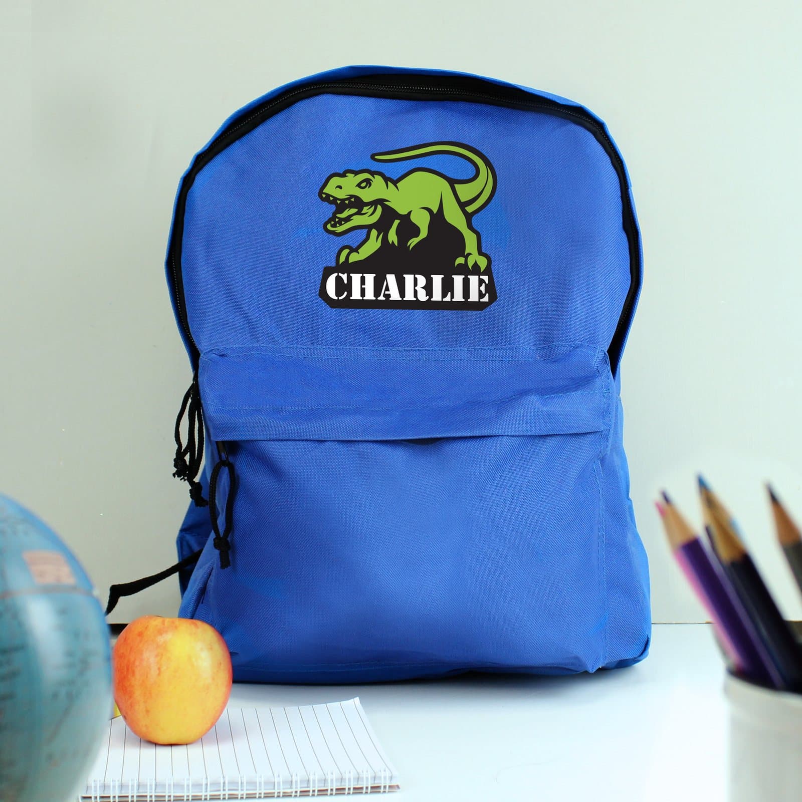 Dinosaur backpack with padded straps, front zip pocket and a personalised name
