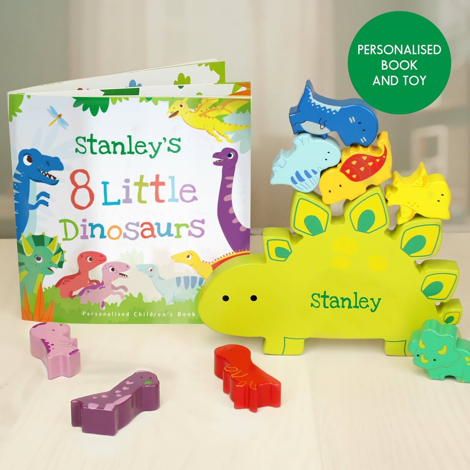 Personalised dinosaur book with a wooden stacking dinosaur toy