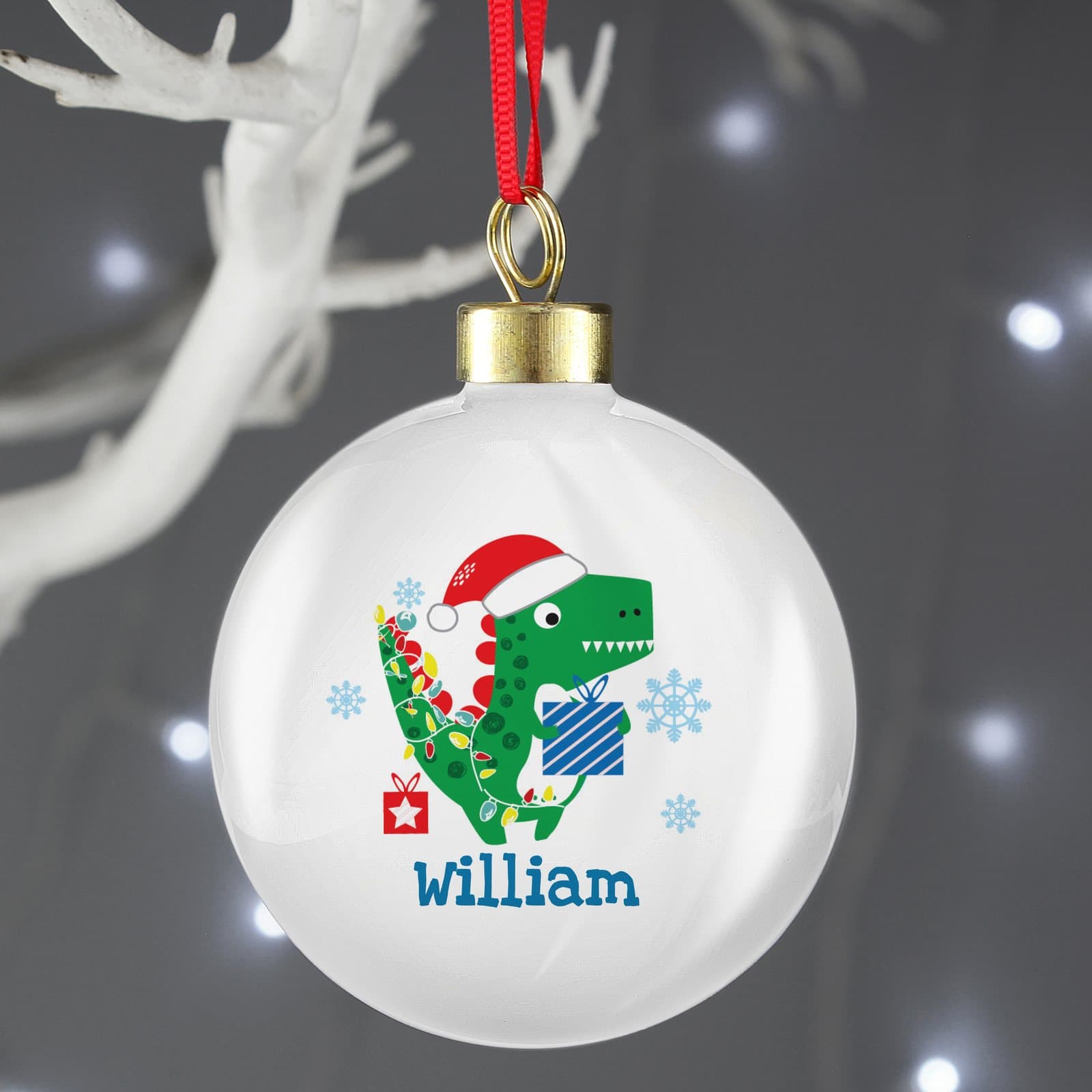 Dinosaur Christmas bauble with a ribbon and Have a roarsome Christmas text