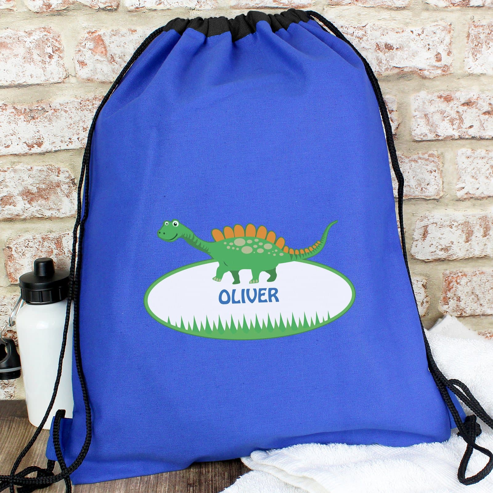Drawstring dinosaur kit bag with a personalised name