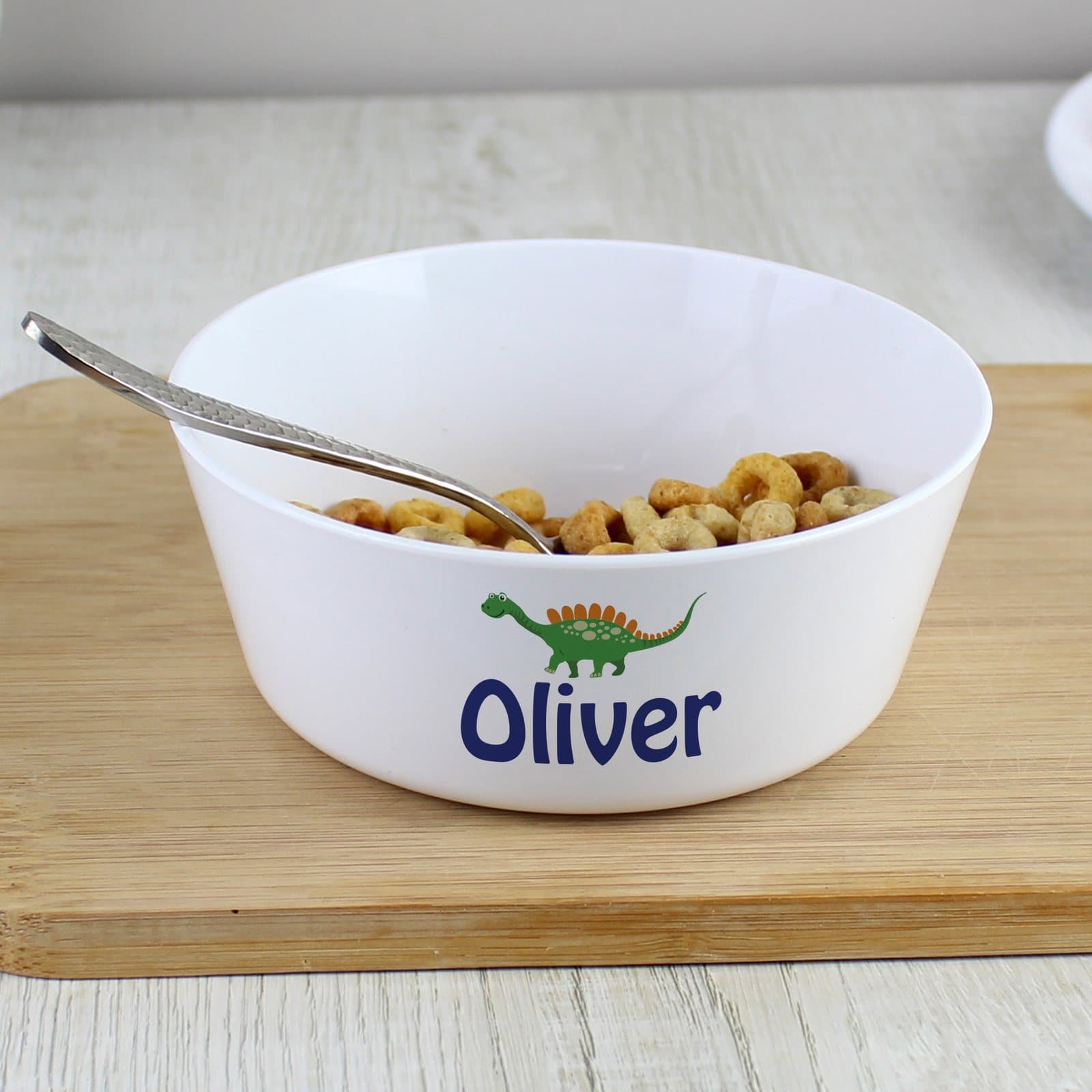 Plastic children's bowl with a dinosaur design and a personalised name