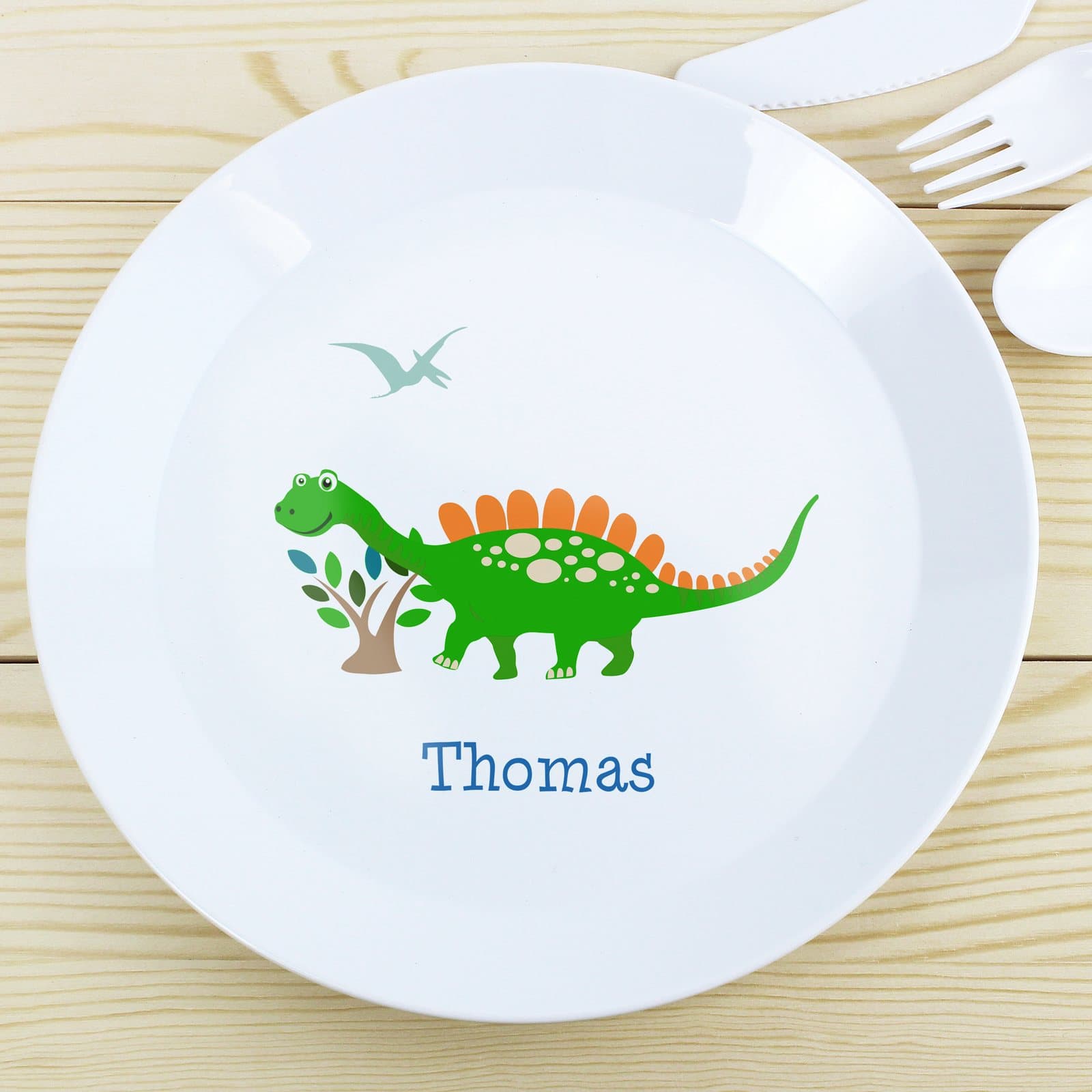 Plastic children's plate with a dinosaur design and a personalised name