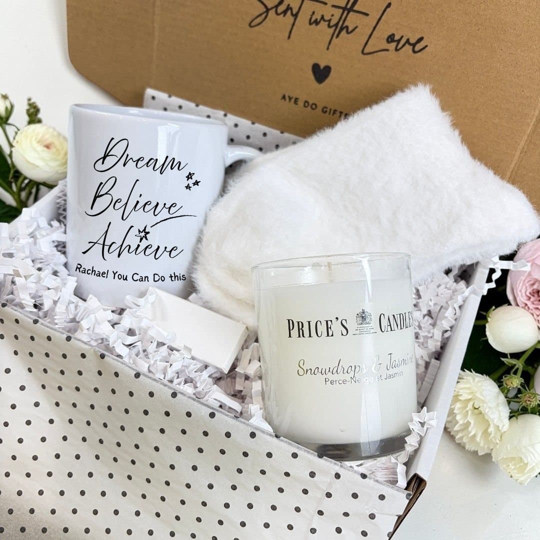 Dream Believe Achieve mug, fluffy socks, scented candle and matches in a hamper