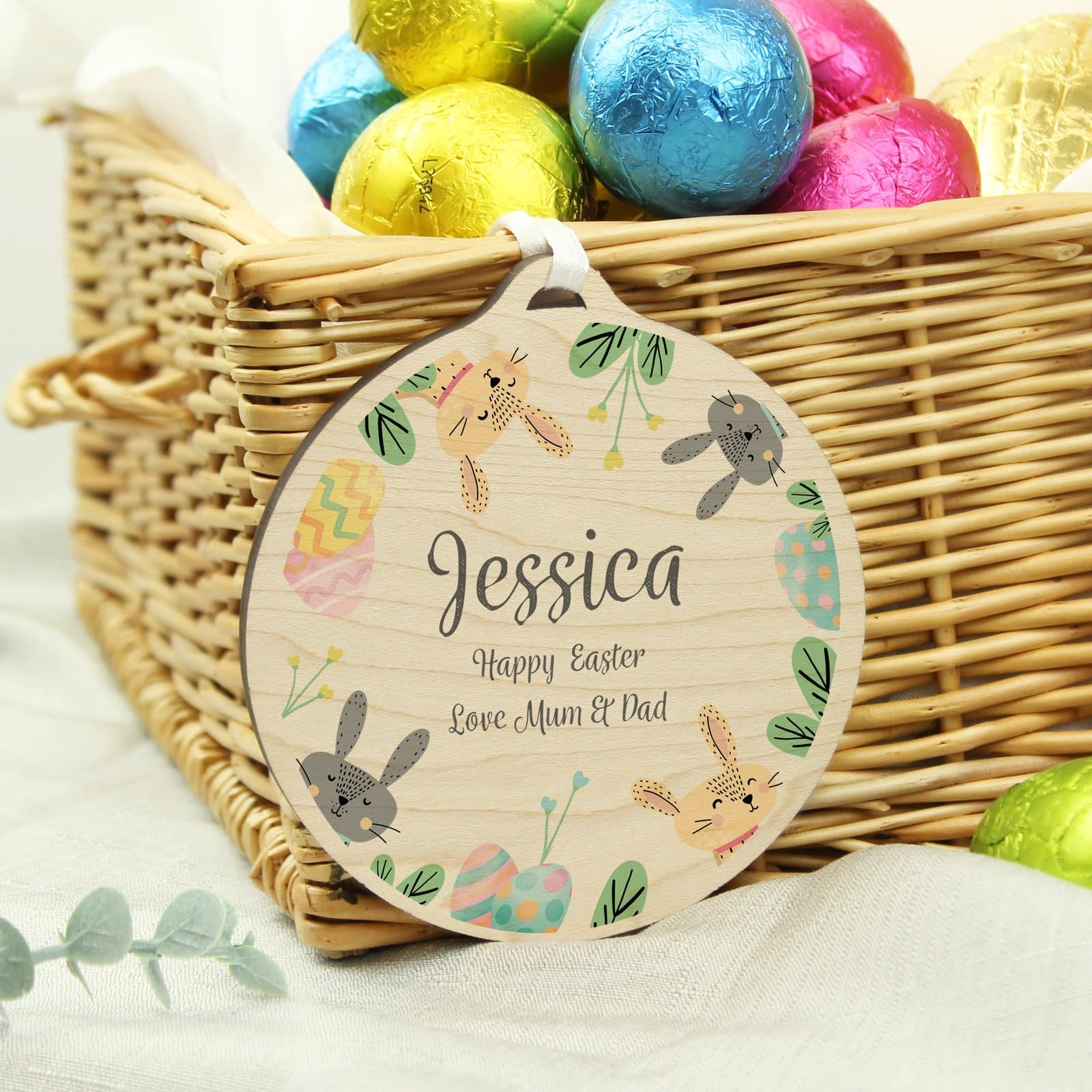 Round wooden Easter bunny decoration personalised in script font with ribbon