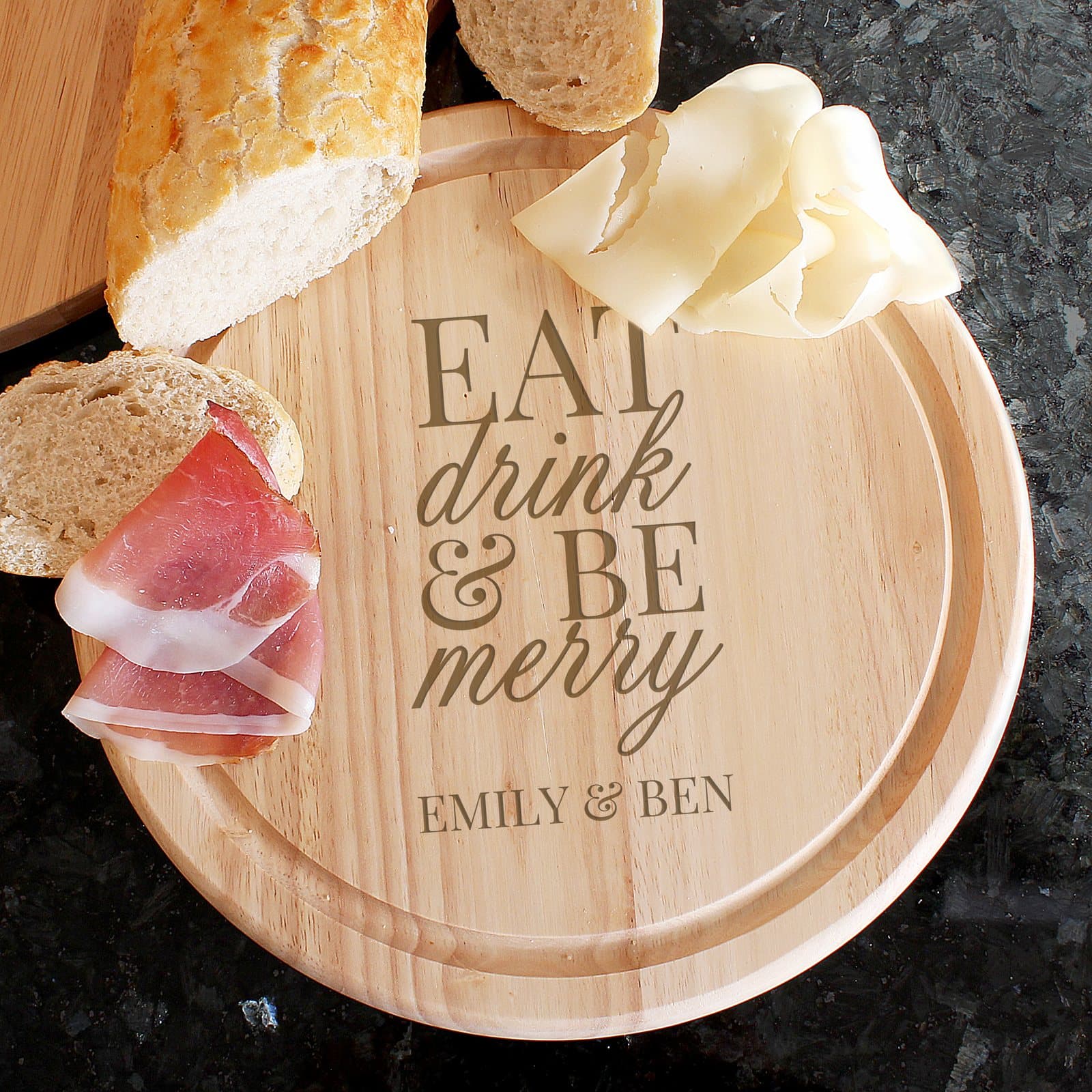 Natural wood Eat Drink & Be Merry chopping board with a personalised line
