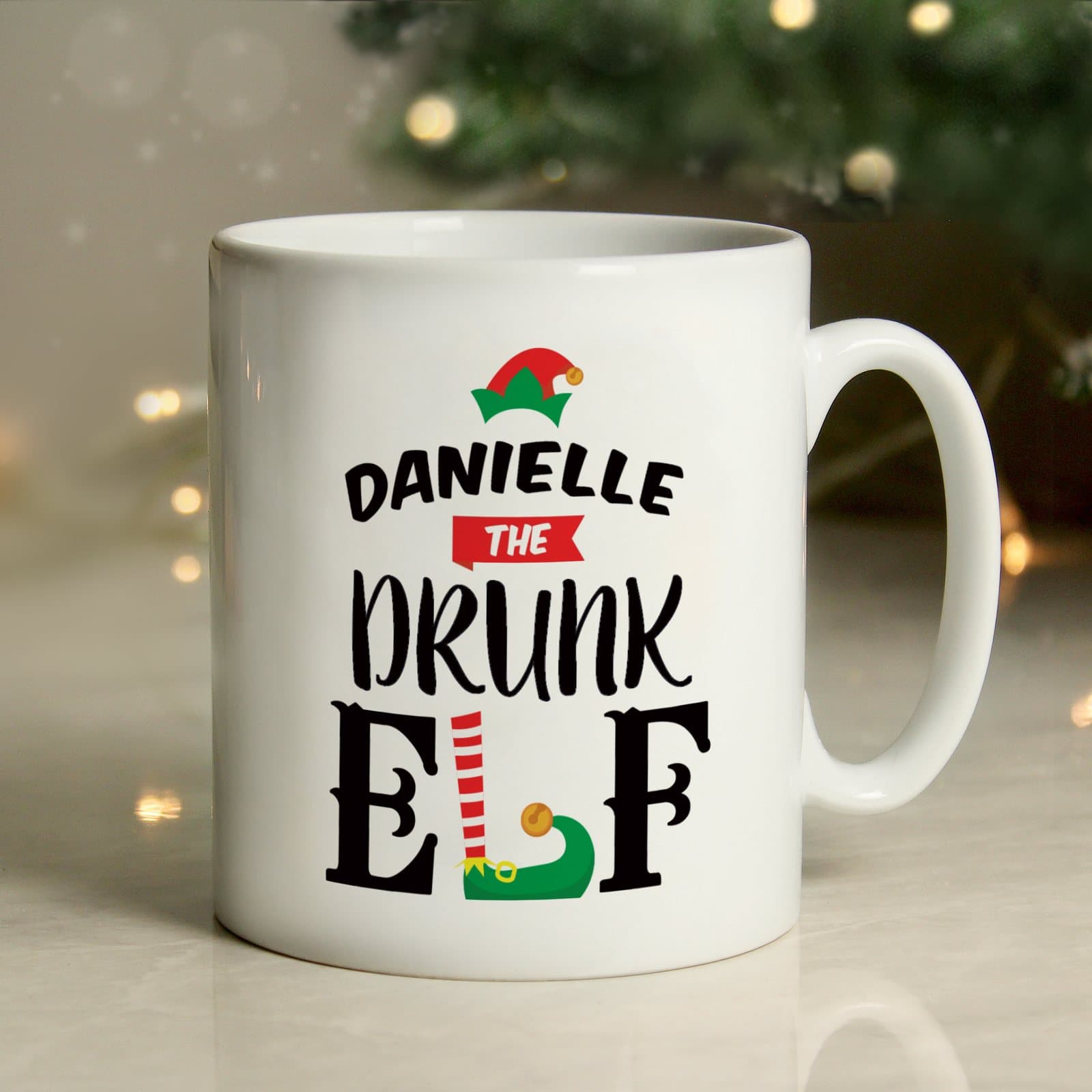 Personalised ceramic Christmas mug with elf text