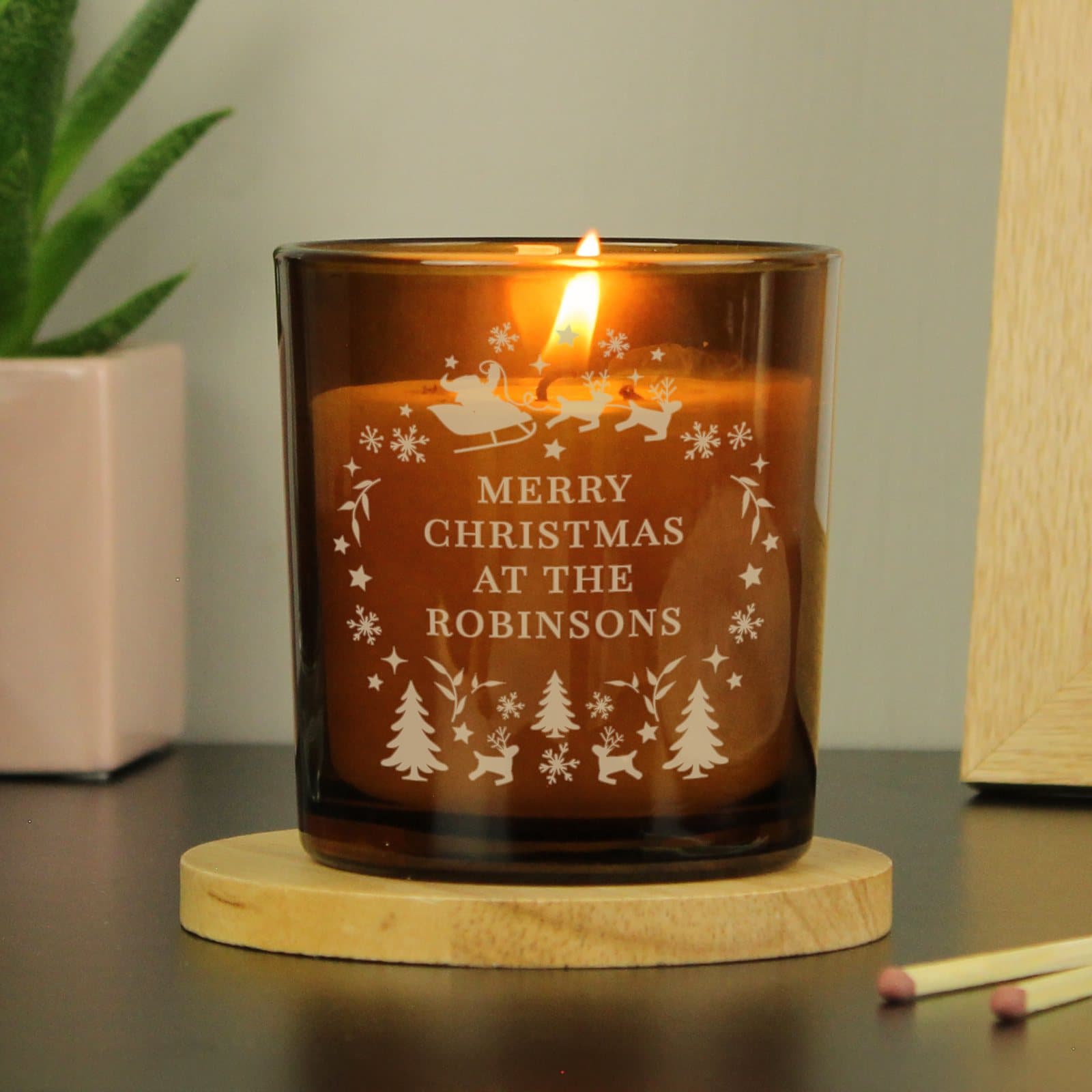 Amber glass candle jar with personalised Christmas text