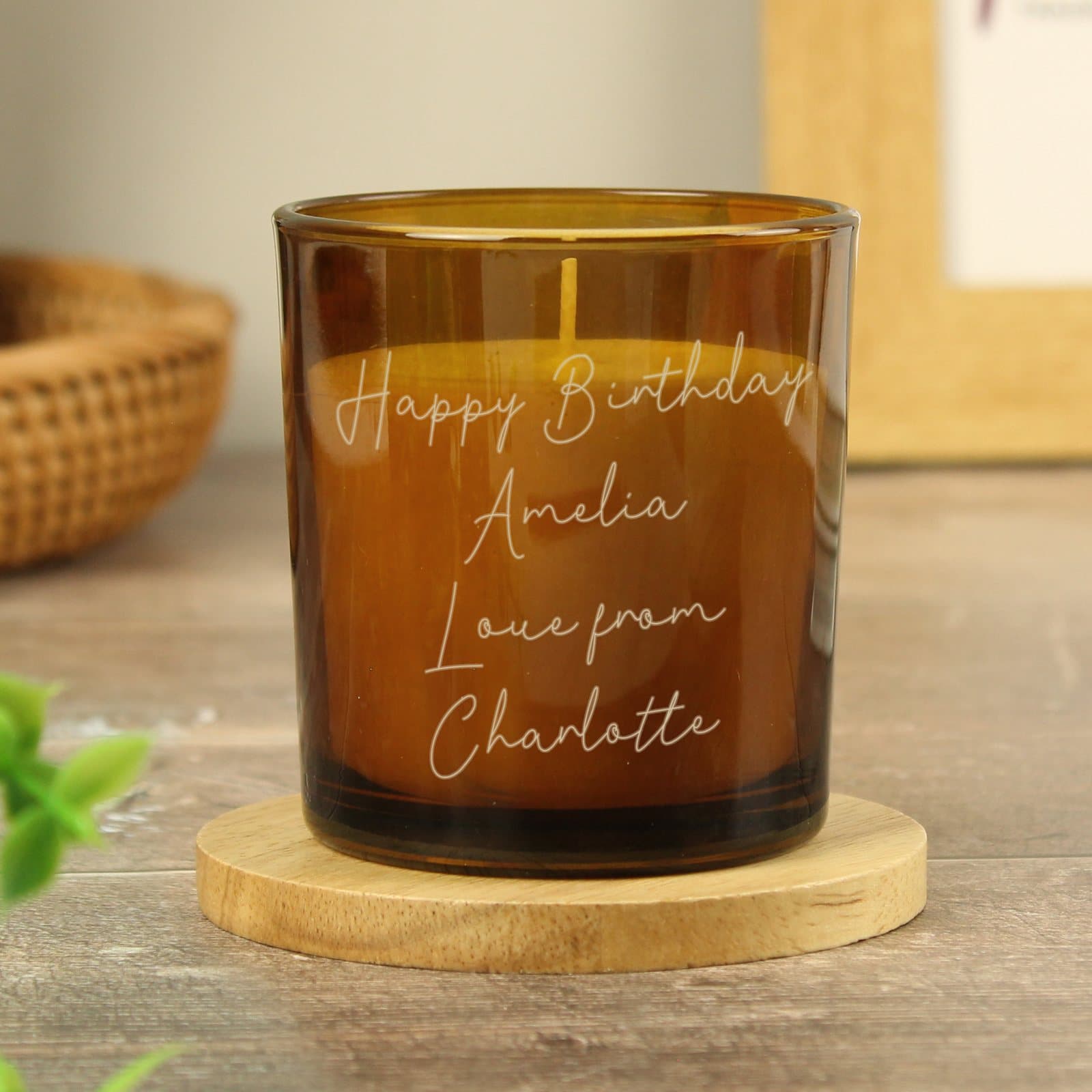 Amber glass candle jar personalised with a four line script message