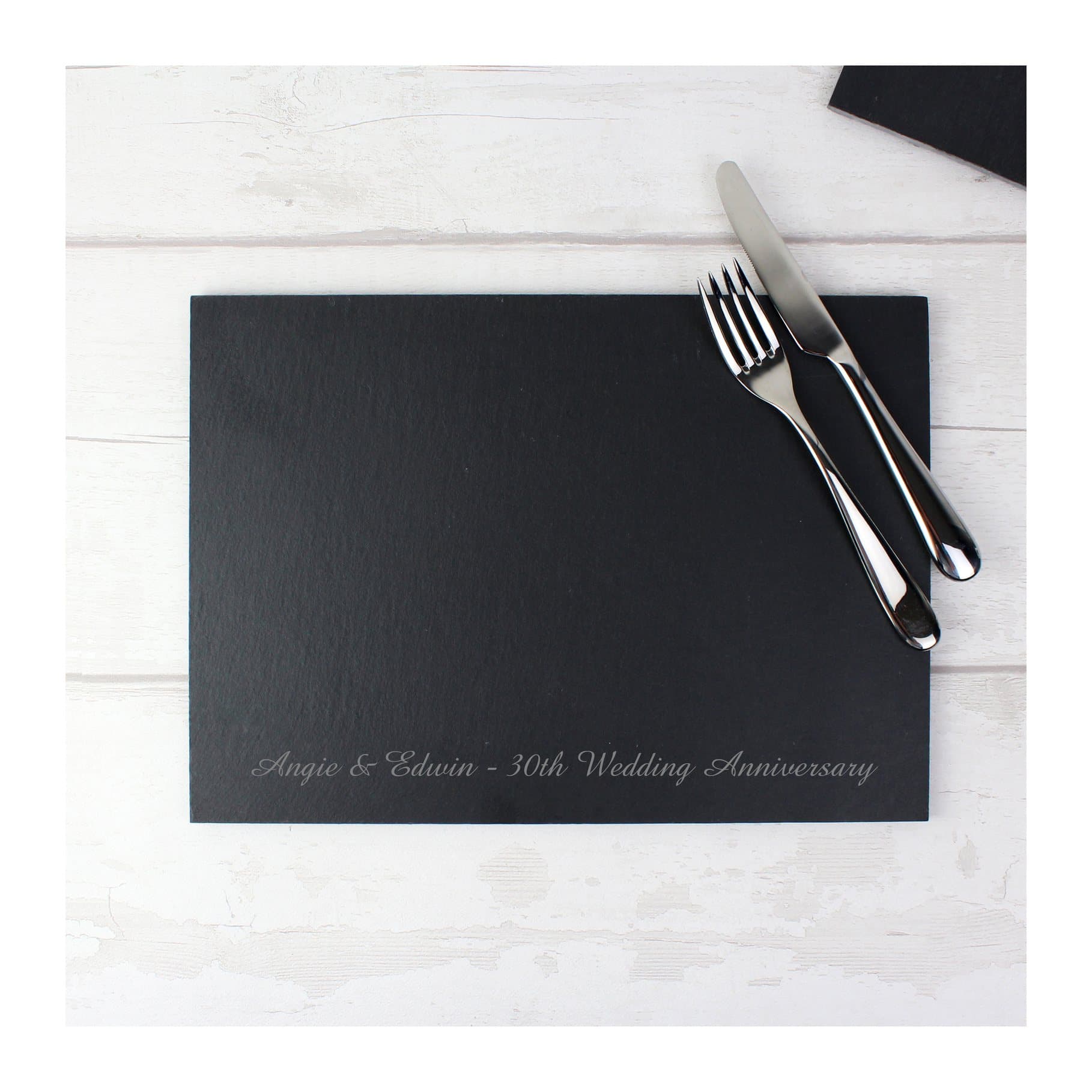 Slate placemat with engraved line of text