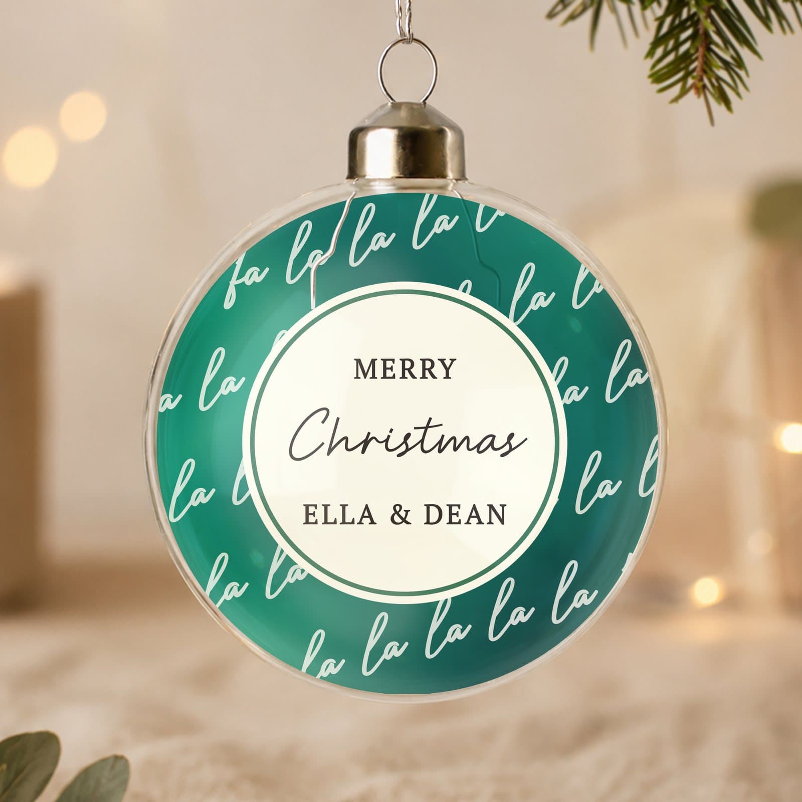 Glass Christmas bauble with a Fa La La design