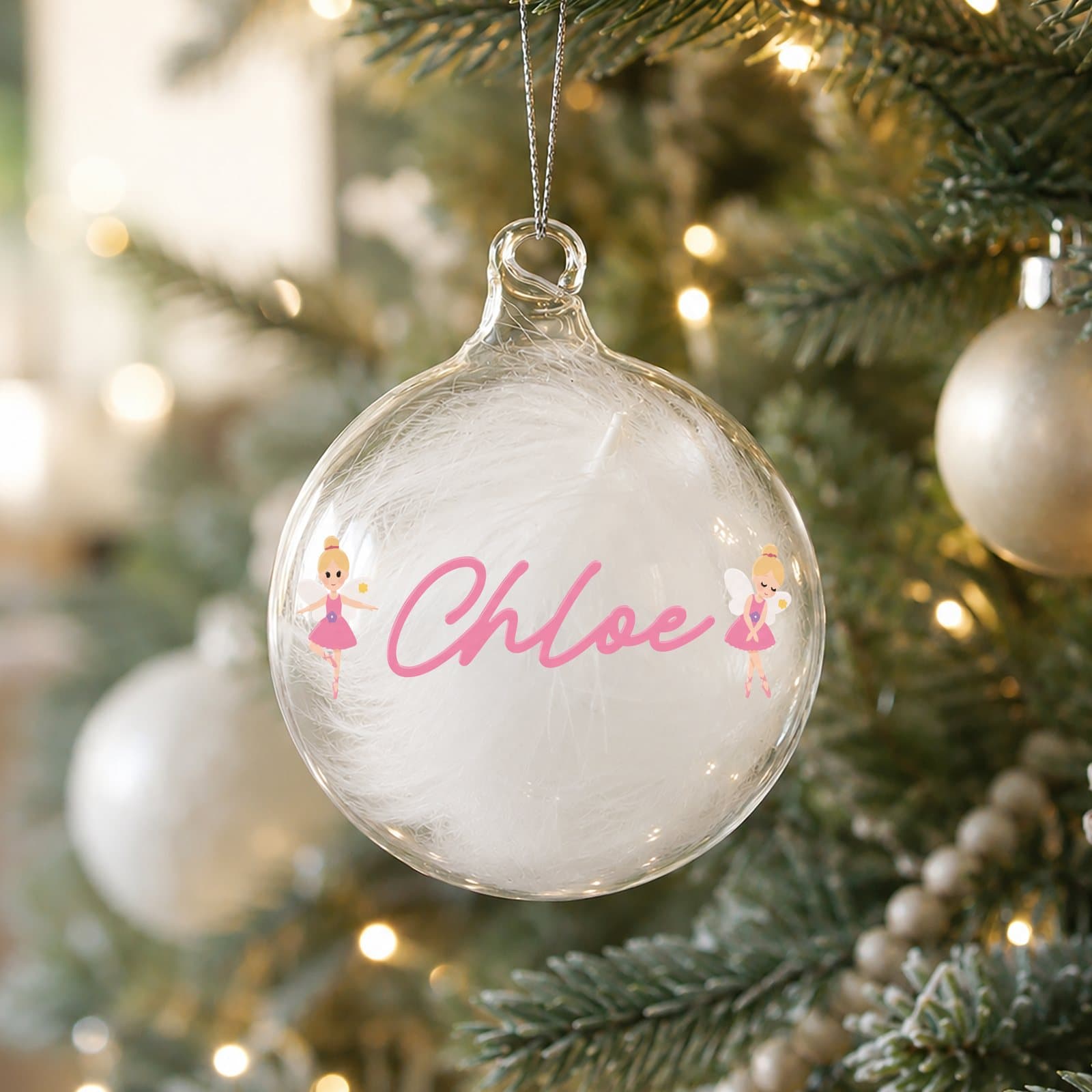 Glass bauble filled with a delicate white feather