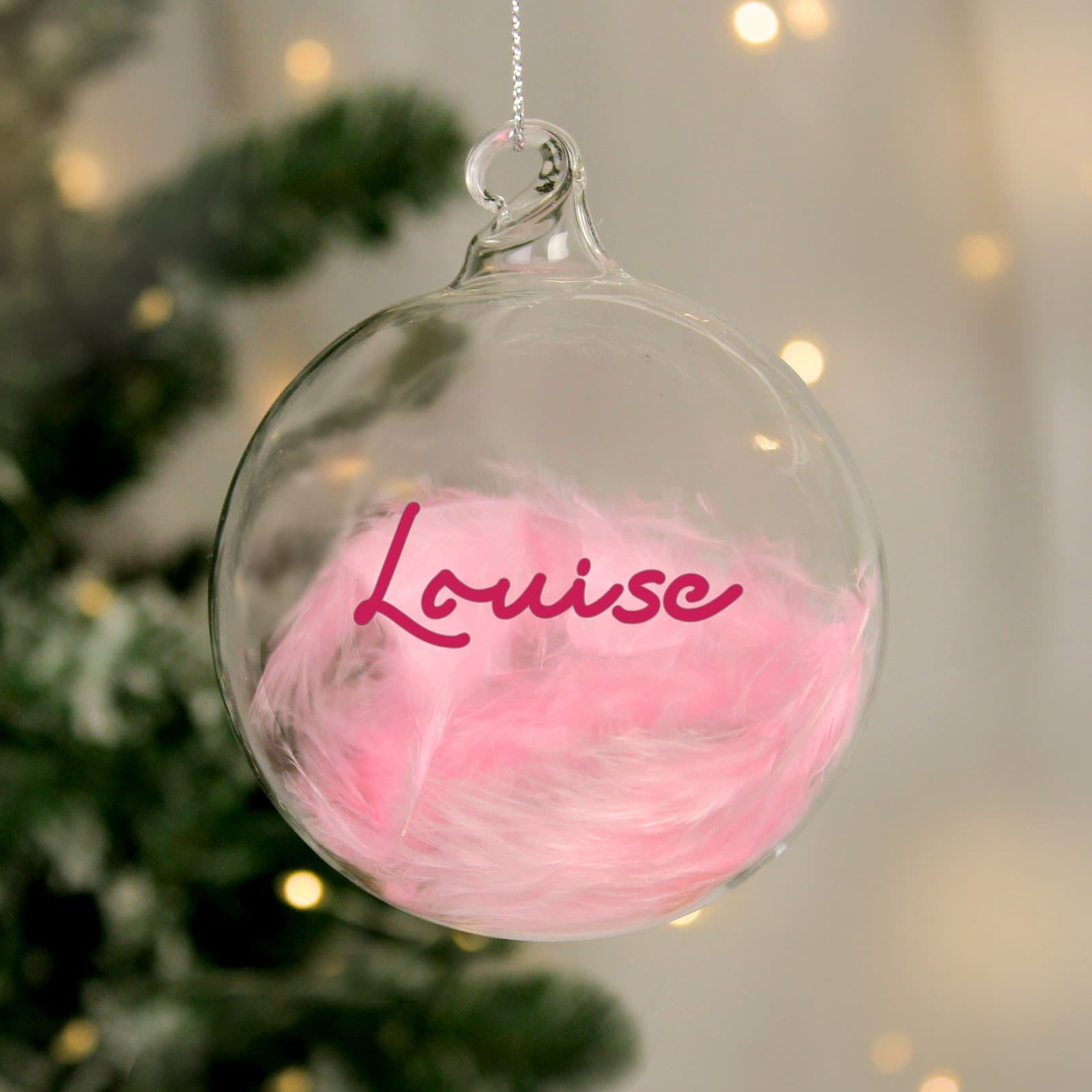 Glass bauble filled with a pink or blue feather with a name