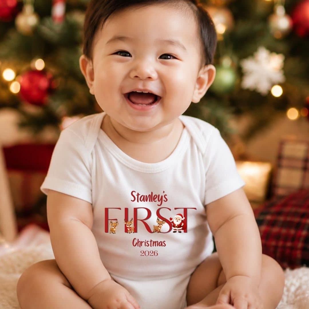 Teddy and baby vest with the First Christmas Santa team design