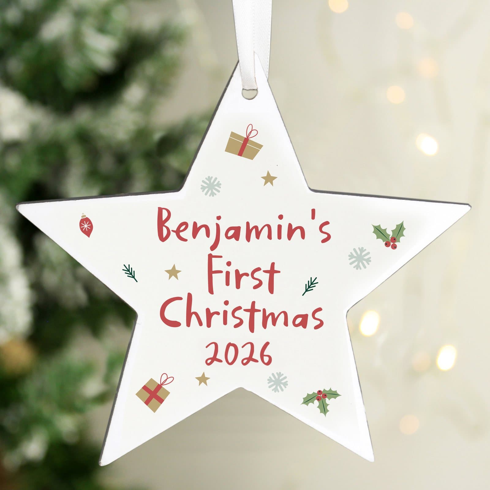 Rustic wooden star first Christmas decoration with ribbon