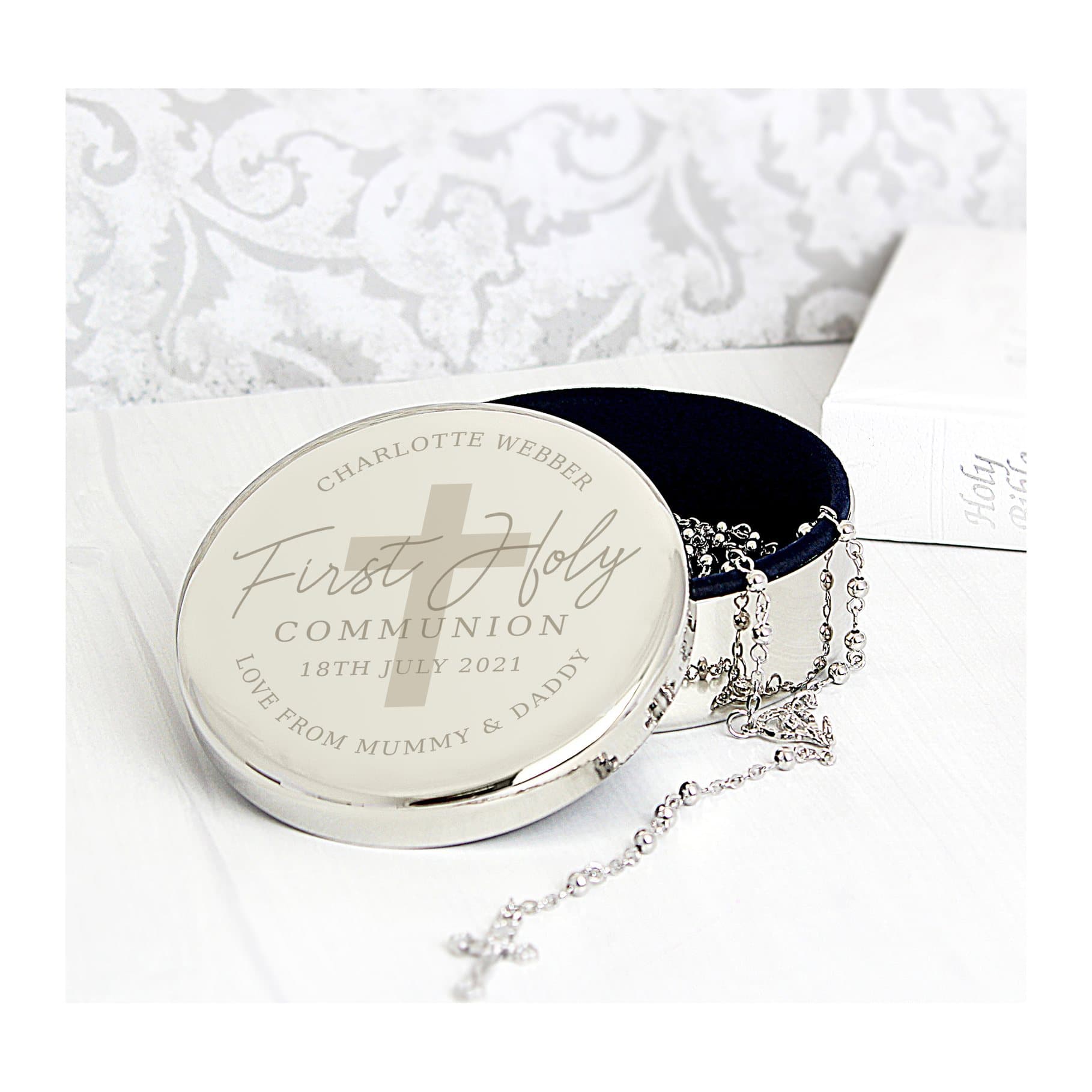 Round trinket box with a set of rosary beads